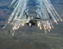 f22-raptor-flares-military-aircraft-gray-wallpaper.jpg